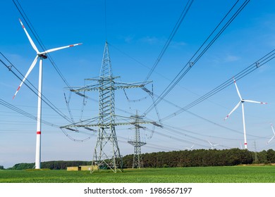 Wind turbines , power poles with power lines