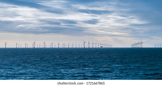 Wind Turbines At Sea. Offshore Wind Power Farm In The North Sea, UK