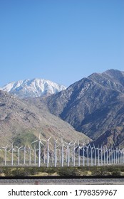 Wind Turbines With Snowy Mountian