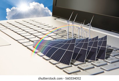 Wind turbines and solar panels on laptop keyboard