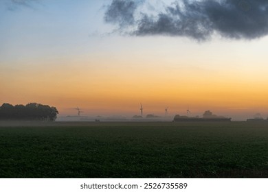 Wind turbines and sun rise - Powered by Shutterstock