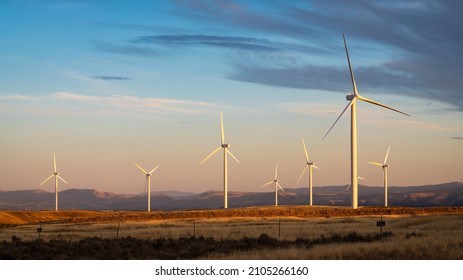 Wind turbines under calm evening sky in Eastern Washington State - Powered by Shutterstock