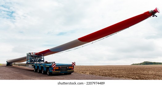 Wind Turbines Under Construction. Blade For Wind Turbines Close Up. Special Transport Of A Blade For A Wind Turbine On A Special Semi-trailer