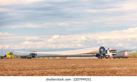 Wind Turbines Under Construction. Blade For Wind Turbines Close Up. Special Transport Of A Blade For A Wind Turbine On A Special Semi-trailer