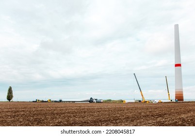 Wind Turbines Under Construction. Blade For Wind Turbines Close Up. Special Transport Of A Blade For A Wind Turbine On A Special Semi-trailer