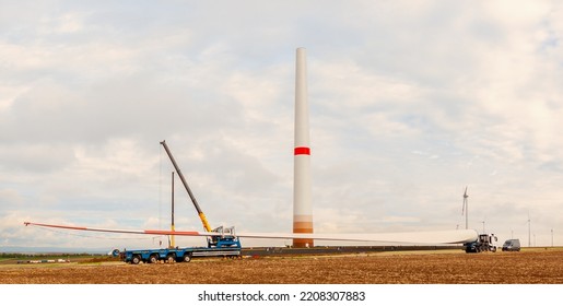 Wind Turbines Under Construction. Blade For Wind Turbines Close Up. Special Transport Of A Blade For A Wind Turbine On A Special Semi-trailer