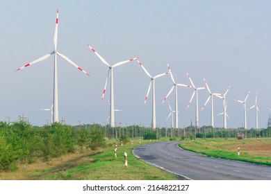 Wind Turbines Windmills Along The Road. Source Of Alternative Electricity. Ecological Renewable Power Sources.