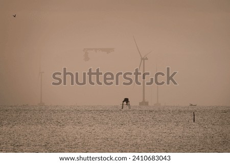 Wind turbines are working on the Tan Thanh sea, Go Cong town, Tien Giang province, Vietnam