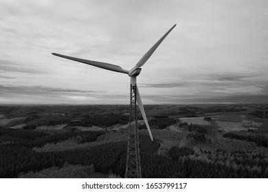 wind wheel over a winter landscape in black and white