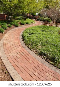 A Winding Brick Path In A Garden