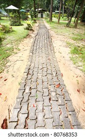 A Winding Brick Path In A Garden