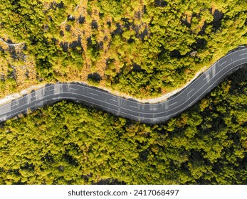 Winding coastal road, rocky cliffs and blue sea in sunny morning. Istria, Croatia - Powered by Shutterstock