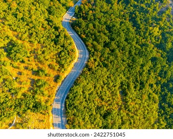 Winding coastal road, rocky cliffs and blue sea in sunny morning. Istria, Croatia - Powered by Shutterstock