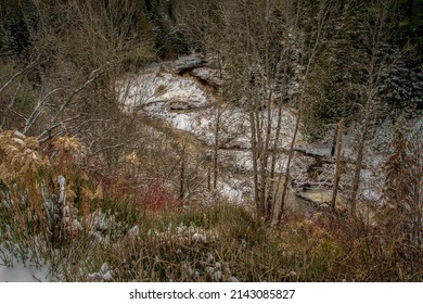 Winding Creek In Autumn In A Valley