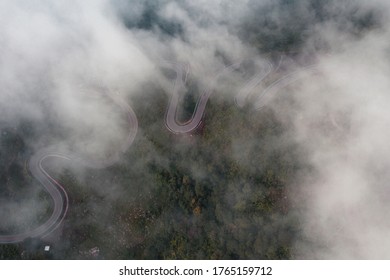 Winding Curvy Rural Road With Light Trail Leading Fog Through,thai Countryside.