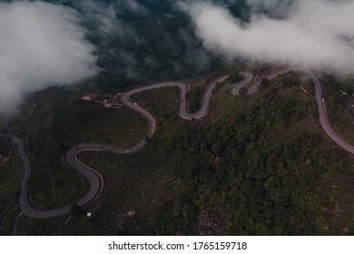 Winding Curvy Rural Road With Light Trail Leading Fog Through,thai Countryside.