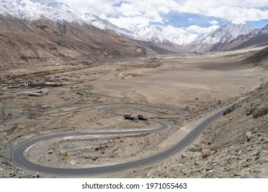 Winding Curvy Rural Road With Light Trail From Headlights Leading Through Ladakh In India.