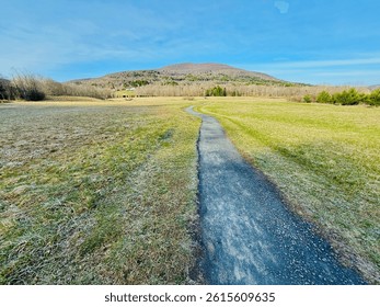 The winding, meandering Windham Path, in spring. Stroll, bike walk, run among a meadow, creek, grassy field, stream. Small mountain town countryside vibe.  Charming ski area in the Catskills