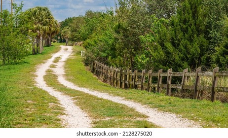 Winding Multipurpose Trail By Wooden Fence And Windbreak In Celery Fields, A Regional Stormwater Facility And Conservation Area Along The Great Florida Birding And Wildlife Trail, In Sarasota, Florida