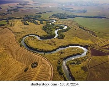 Winding River. Fields. Aerial Shot