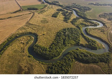 Winding River. Fields. Aerial Shot