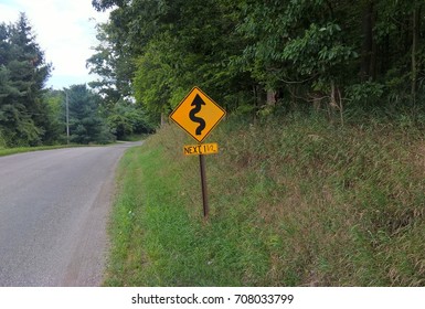 winding road ahead sign