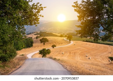 Winding Road In Countryside On Sunset  