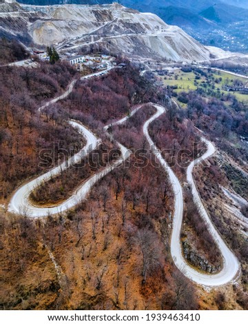 Winding road going to a rock exploatation; autumn scenery! Stock photo © 