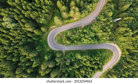 Winding road from the high mountain pass in Kopaonik, Serbia. Great road trip trough the dense woods. Aerial view. - Powered by Shutterstock