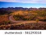 A winding road runs through Bunyeroo Valley in the Flinders Ranges National Park, South Australia, Australia - Outback Australian road.