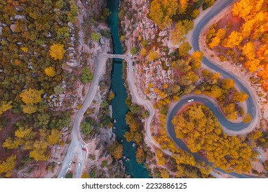 Winding road and stone bridge with river from Koprulu Tazi Canyon. Manavgat Antalya Turkey aerial top view. - Shutterstock ID 2232886125