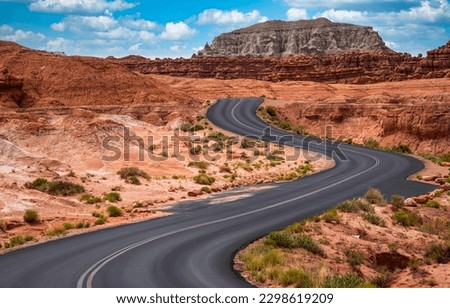 Winding road through the canyon desert. Canyon road in desert. Canyon desert road. Road in canyon desert