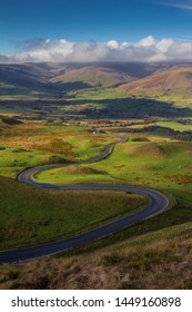 Winding Road Through The English Countryside In Summer