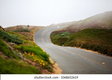 Winding road through the fog on the northern California coast