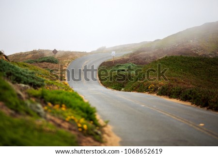 Winding road through the fog on the northern California coast
