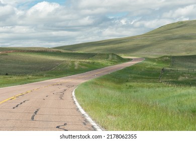 A Winding Road Through The Green Hills Of Western Montana.