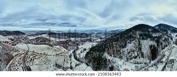 Winding road\
through mountain covered with forest, winter landscape with curvy\
highway among countryside, aerial\
view