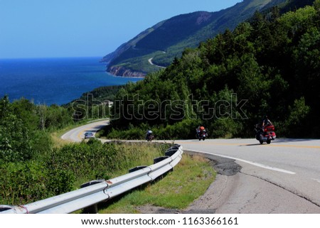 winding roads on cabot trail (cape breton island, canada) on cliffs overlooking the blue green Atlantic Ocean