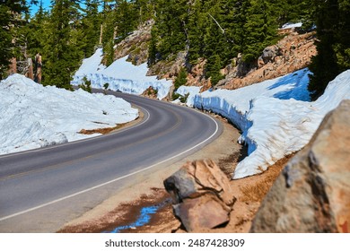 Winding Snow-Covered Mountain Road in Crater Lake National Park Eye-Level - Powered by Shutterstock