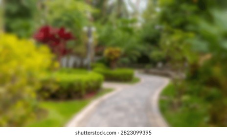 A winding stone pathway meanders through a beautifully manicured garden filled with diverse plants and colorful blossoms.
