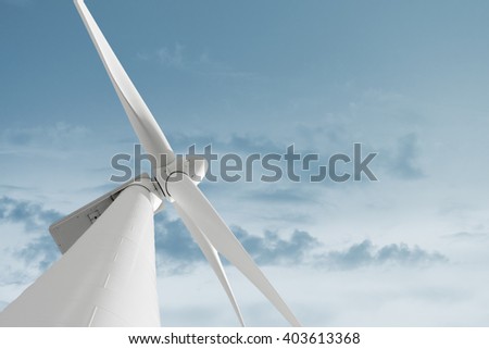 Windmill against cloudy sky with copyspace
