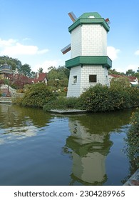 Windmill building by the river