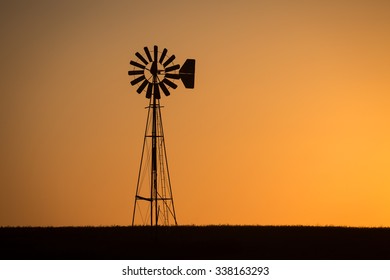 Windmill at Dusk/An old windmill stands on the prairie as another day ends.