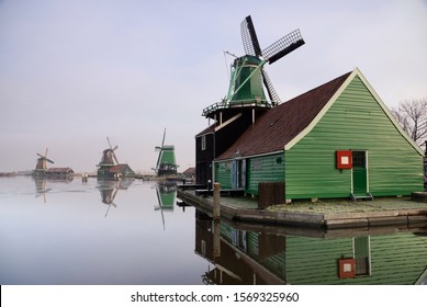 Windmill in the Dutch traditional village Zaanse Schans which is one of the busiest tourist locations in the Netherlands