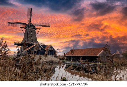 Windmill farm in morning sunrise. Sunrise windmill farm river. Windmill sunrise scene. Windmill sunrise view