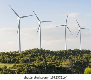 Windmill Farm On Hills Landscape .Green Eco Energy Concept.