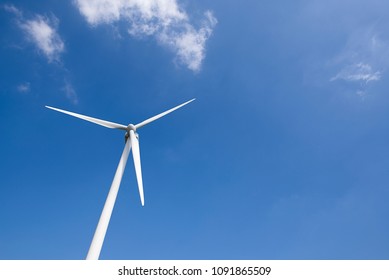 Windmill generating wind energy. Renewal and ecological energies.