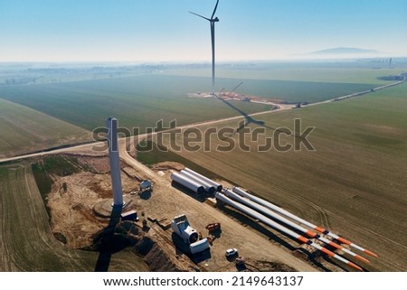 Windmill generator wing prepared for assembling on ground, Construction site for wind power generator building, Green power and renewable energy