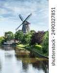 Windmill in Hinte at the Knockster Tief, Galeriehollaender, Hinte, East Frisia, Lower Saxony, Germany