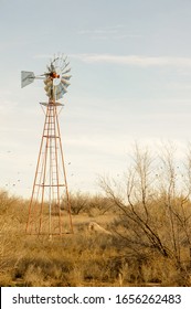 windmill in the middle of a desert